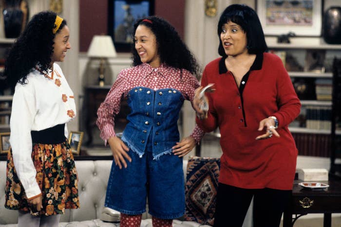 Tamera Mowry, Tia Mowry, and Jackée Harry smiling during a scene