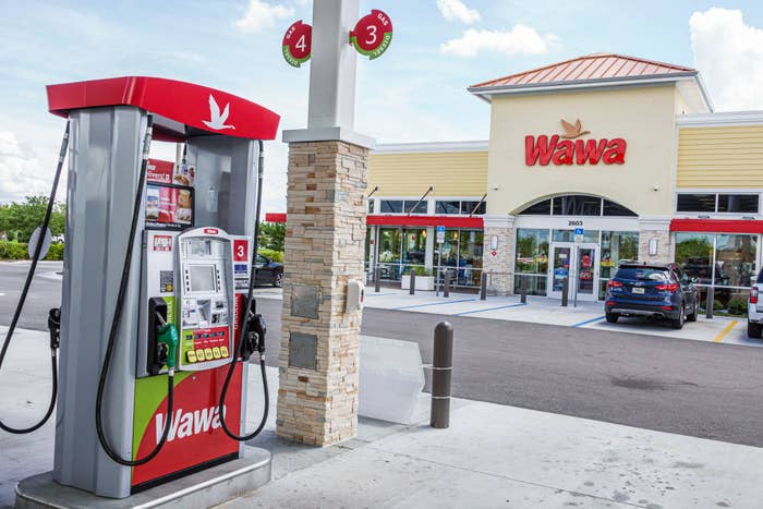Exterior of Wawa marketplace with gas pump