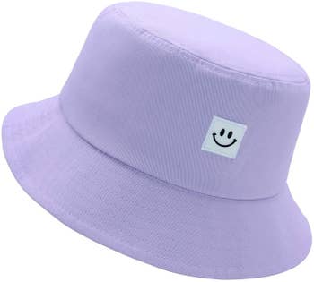 the hat in purple with a smiley face design