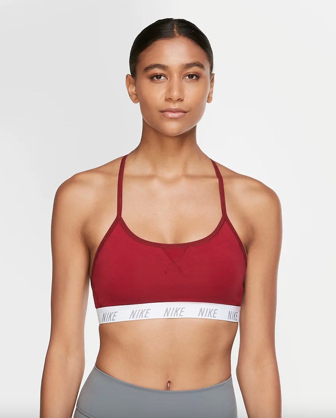The light support padded bra in red with a white band