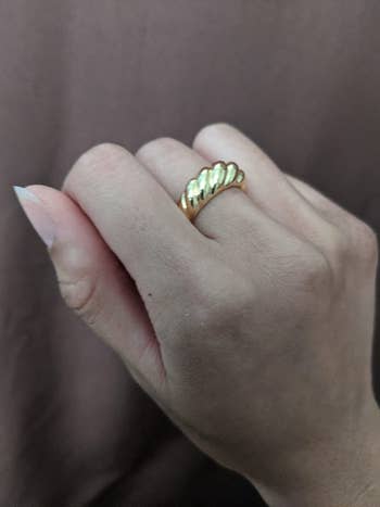 the same reviewer wearing the croissant ring