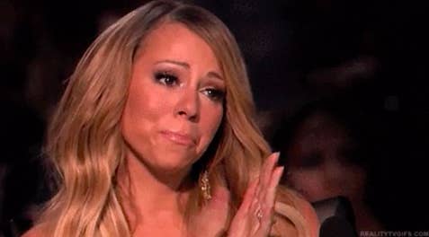 Mariah Carey clapping and nodding in agreeance
