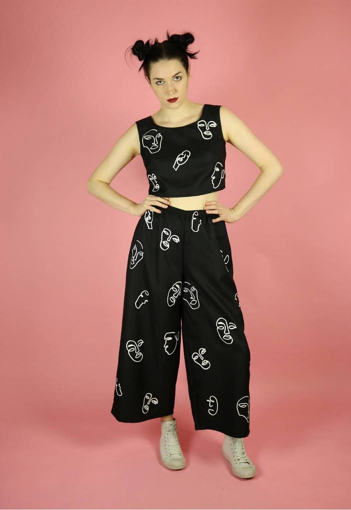 crop tank top and matching black wide pants with white squiggly faces