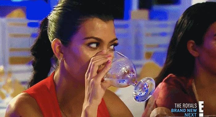 Kourtney Kardashian drinking a glass of water