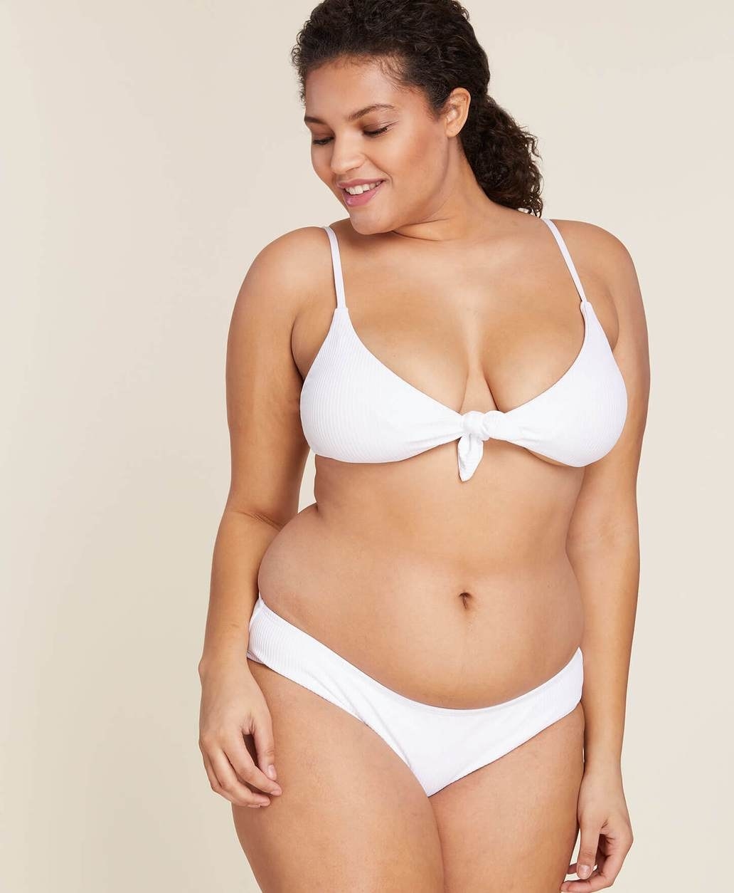 model wearing the white bikini top and bottom
