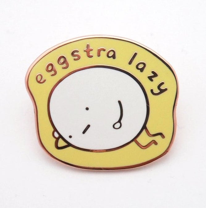 egg with tired face lying on side that says &quot;eggstra lazy&quot;