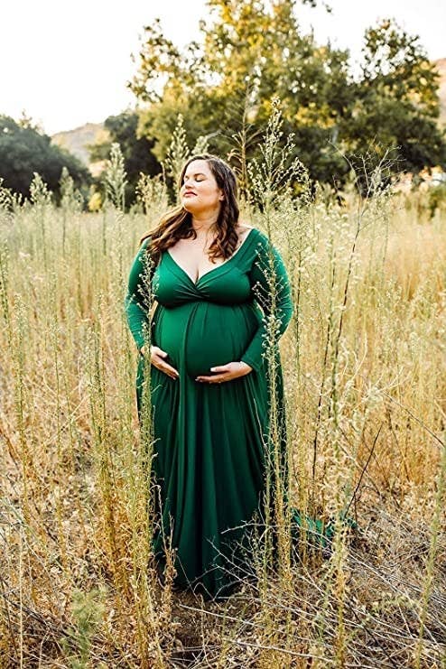 pregnant person wearing long sleeve flowy dress for maternity photos