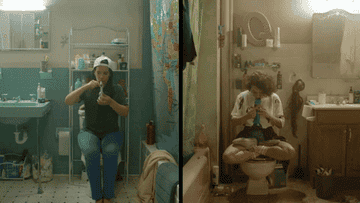 Split screen of Abbi and Ilana on their respective toilets smoking from bongs