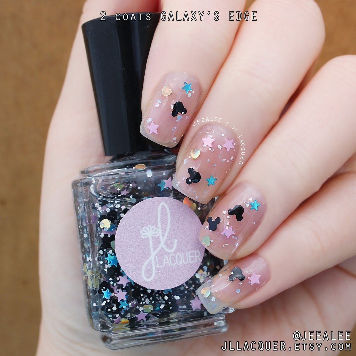 clear nail polish with mickey mouse and star confetti 