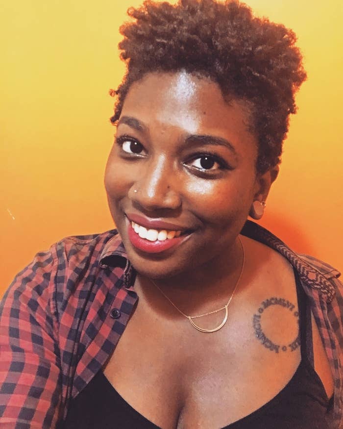 An image of the author against an orange backdrop