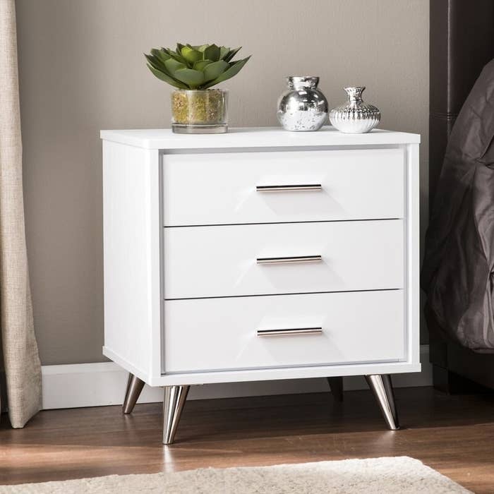 white nightstand with stainless steel detail