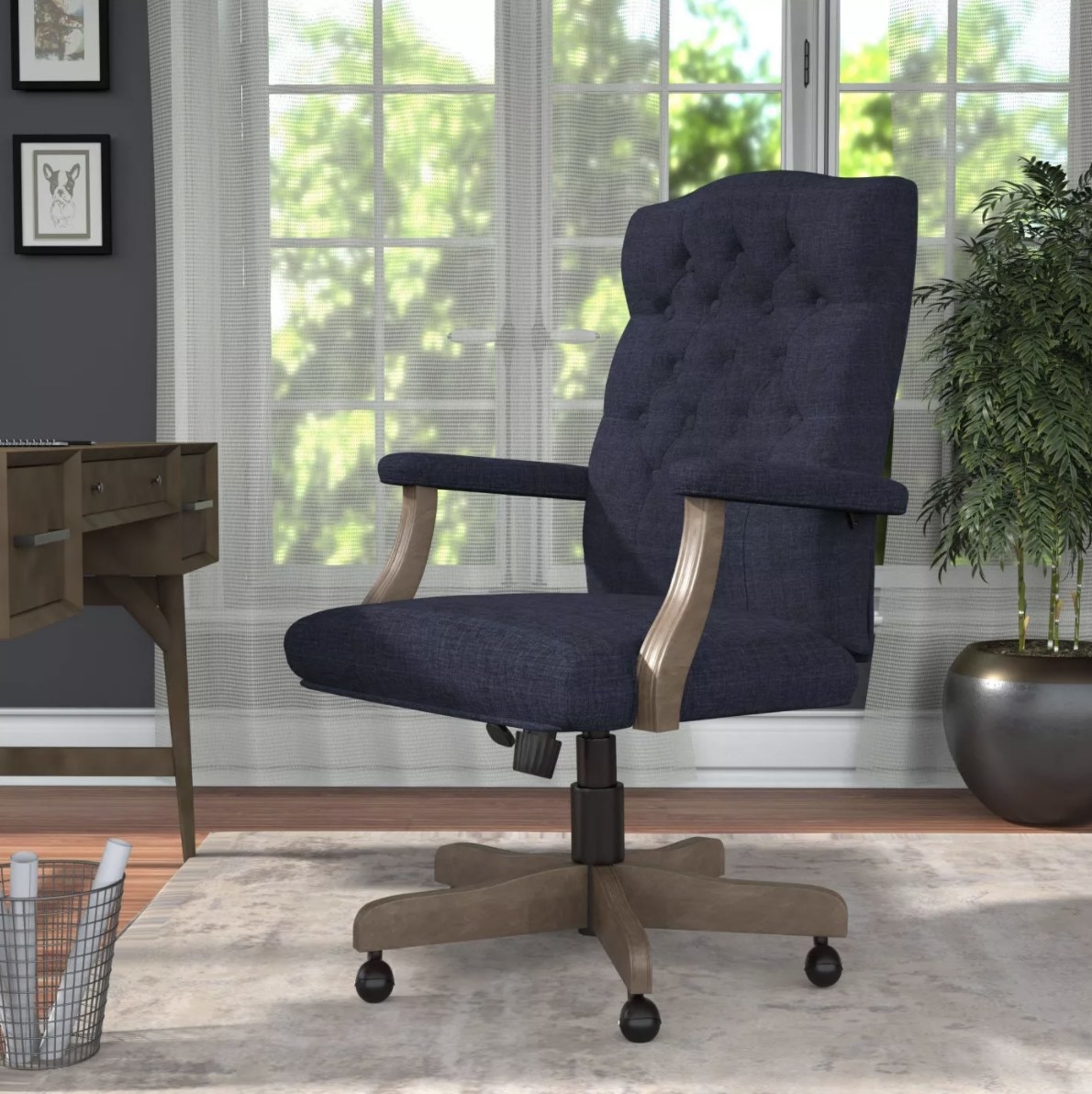 The navy blue fabric chair with wooden detailing stands out in a sunlit office