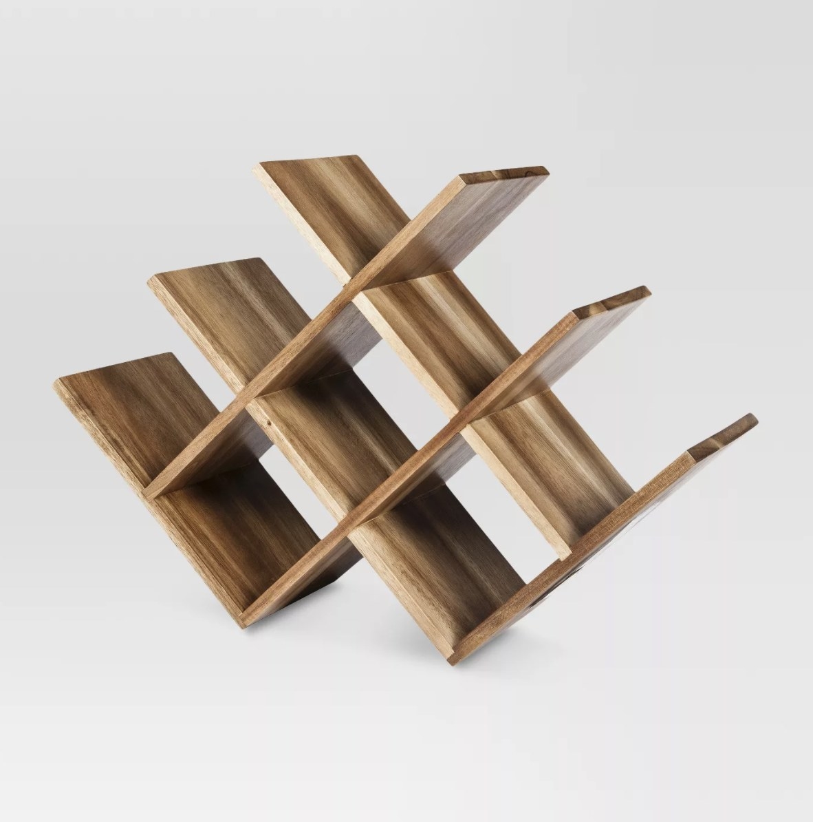 The light brown wood is in a beautiful geometric shape with eight spots for wine bottles 