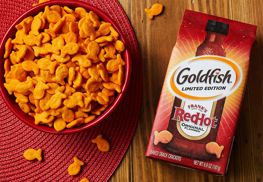 A close up shot of the bowl of Goldfish next to the packaging