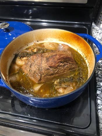 Reviewer photo of a roast inside their blue Dutch oven