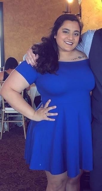 different reviewer wearing the dress in blue