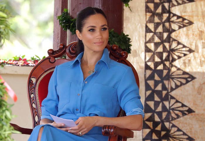 Meghan Markle talks with students during a visit to Tupou College in Tonga