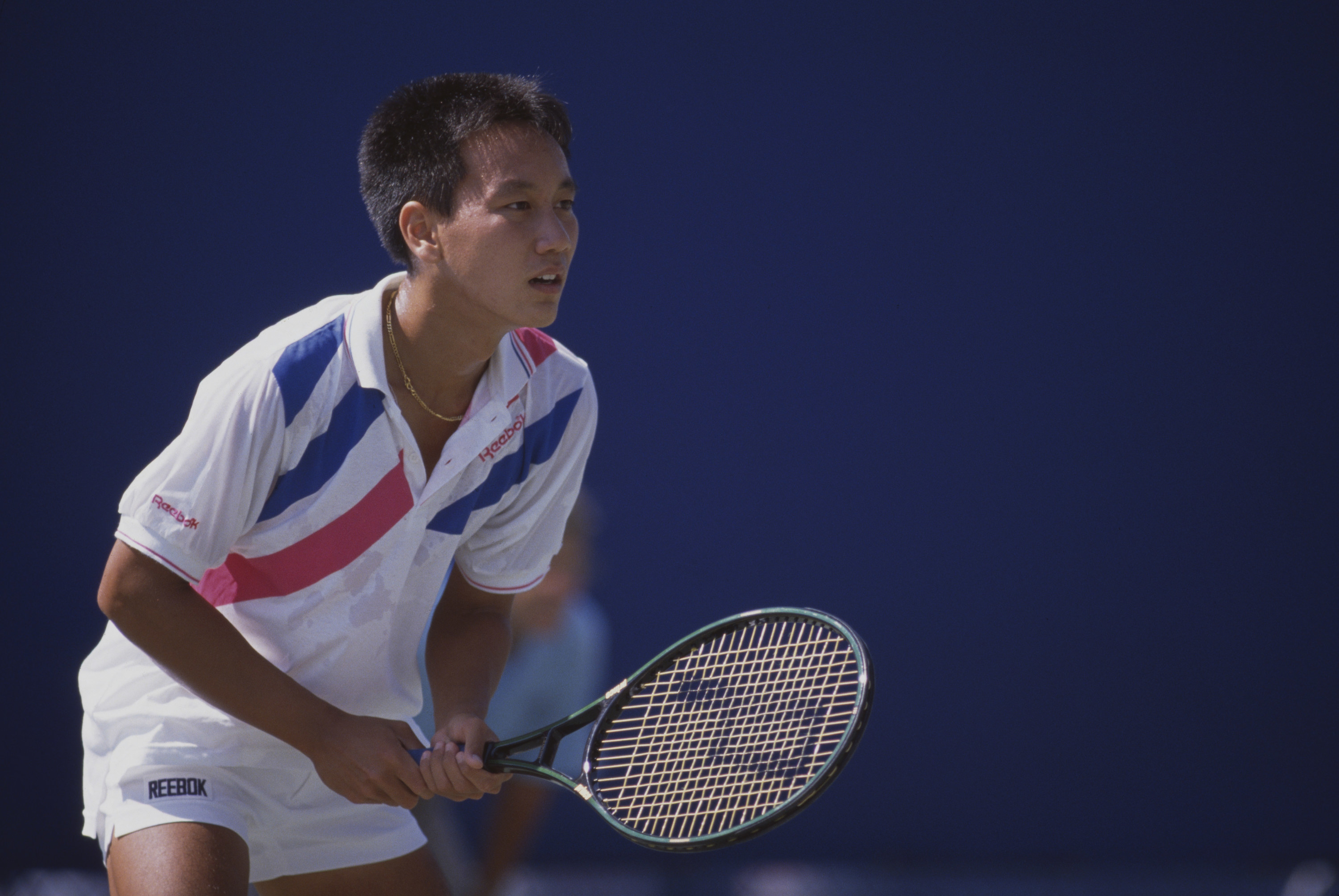 Michael Chang with a tennis racket