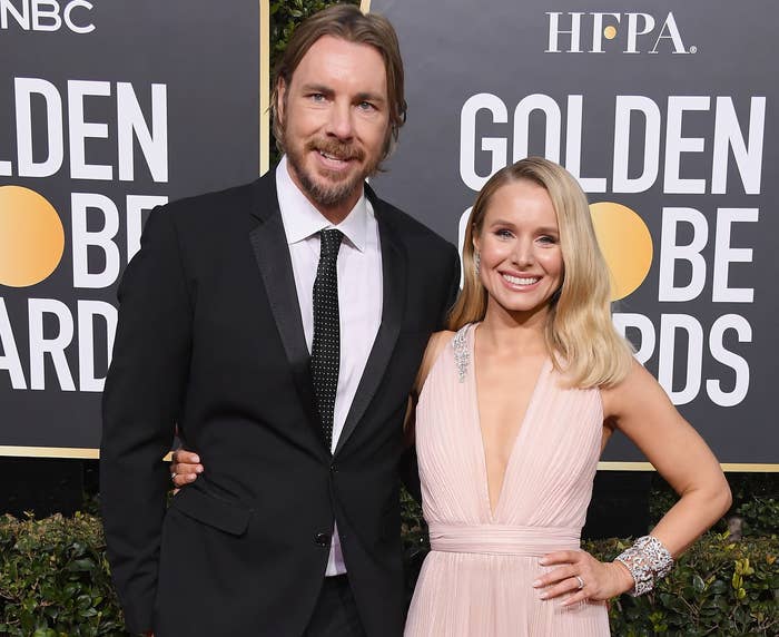 Kristen and Dax pose together on a red carpet