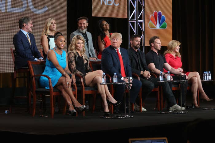 Vivica sits onstage with Donald Trump and the other contestants