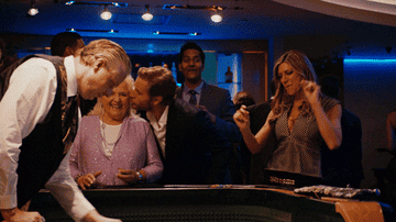 A woman dancing at a gambling table