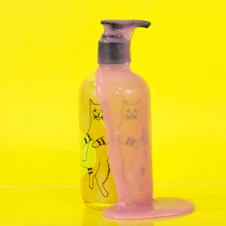 Soap bottle with the gooey product spilling out of the cap 