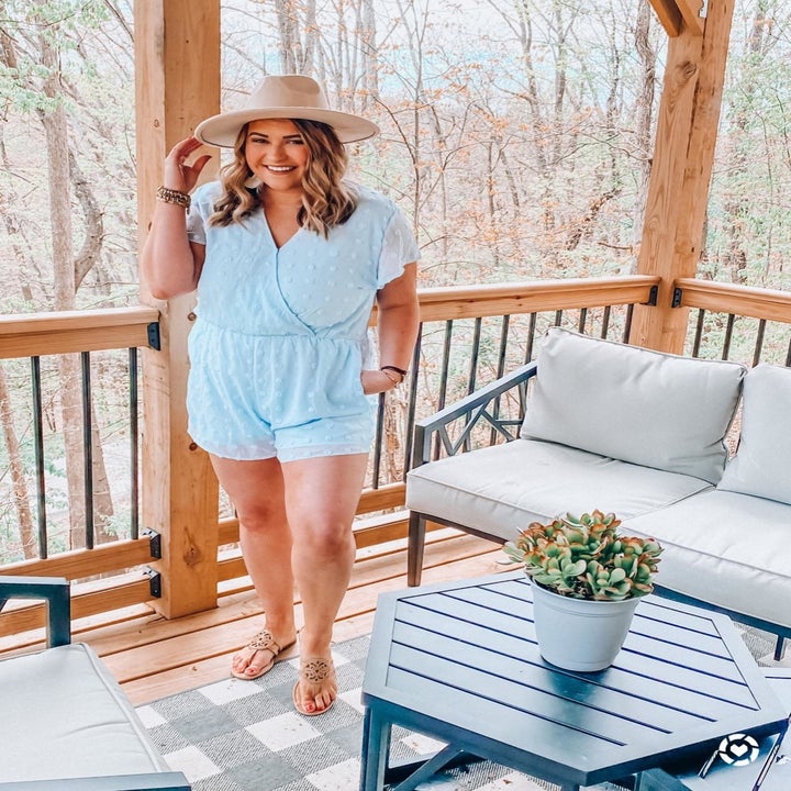 reviewer wearing the blue romper in XXL