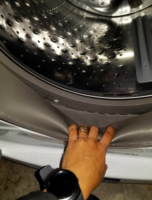 Reviewer showing the inside of washer clean after using product 