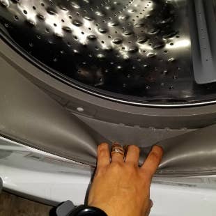 Reviewer showing the inside of washer clean after using product 