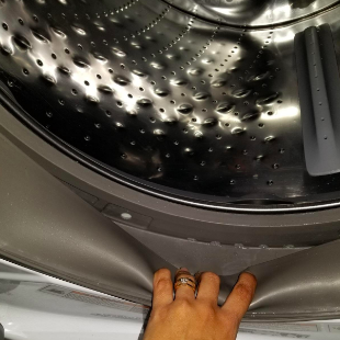 Reviewer showing the inside of washer clean after using product 