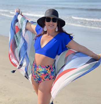 reviewer wearing the blue bikini top and floral bottom