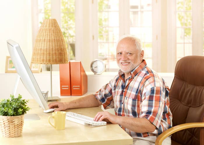 An old man using the computer