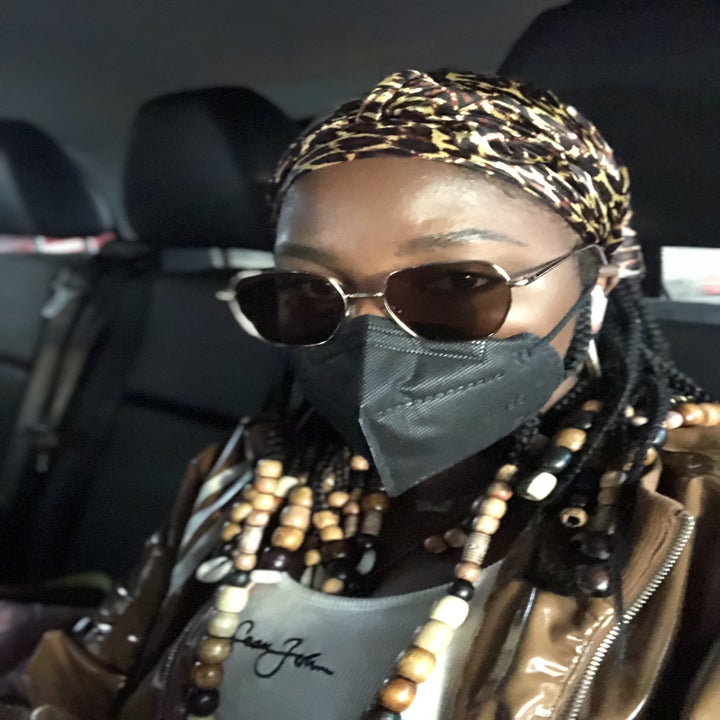 A reviewer wearing the leopard print scarf