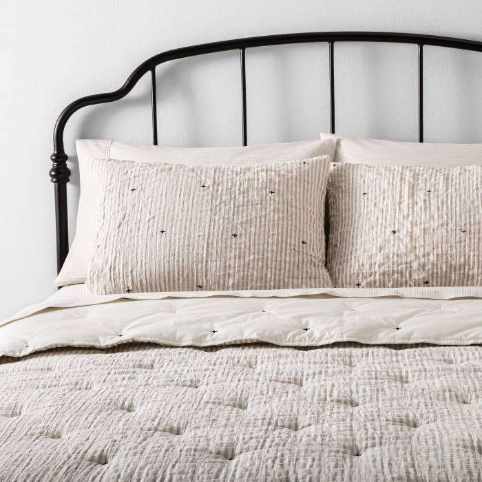 A neutral comforter set in a home