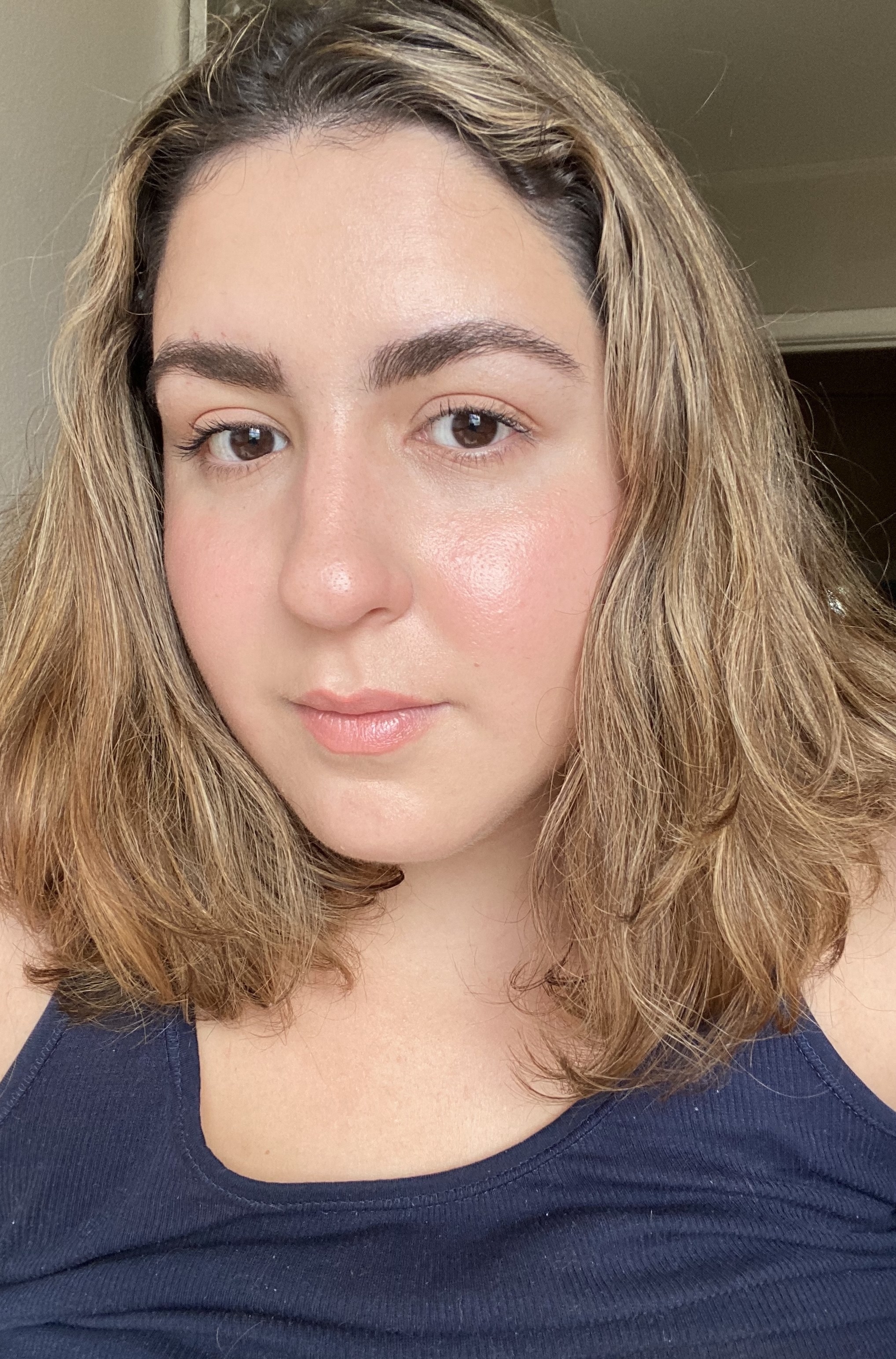 the writer&#x27;s wavy hair looking nice and smooth after an Olaplex treatment