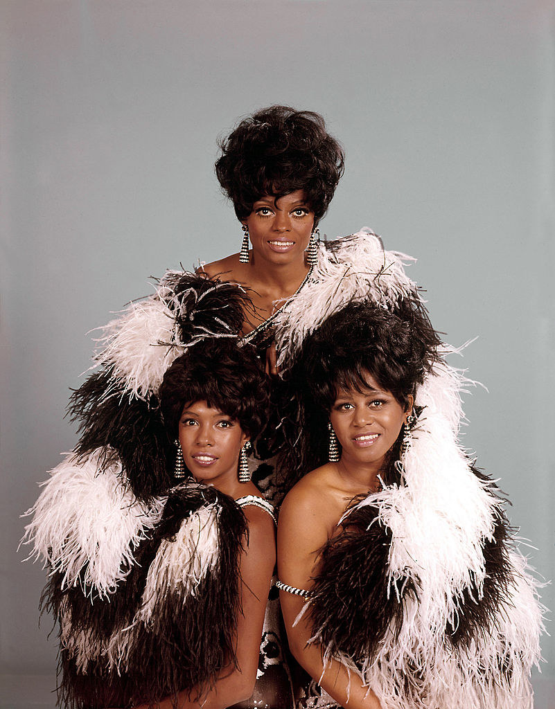 Diana Ross &amp; the Supremes posing for a portrait with glamorous fur shawls in 1970