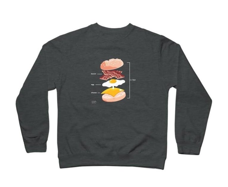 grey sweatshirt with all the layers of a bacon egg and cheese sandwich 