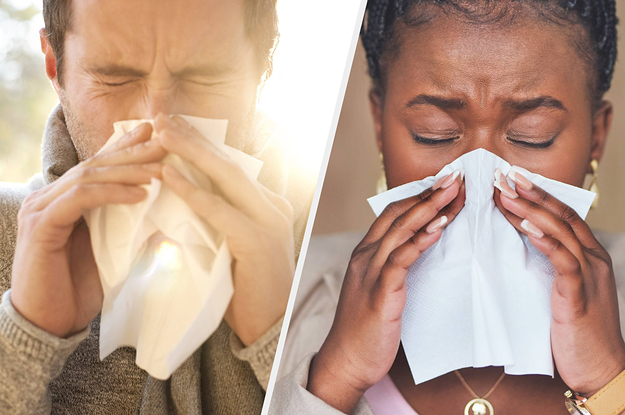 A man and woman sneezing