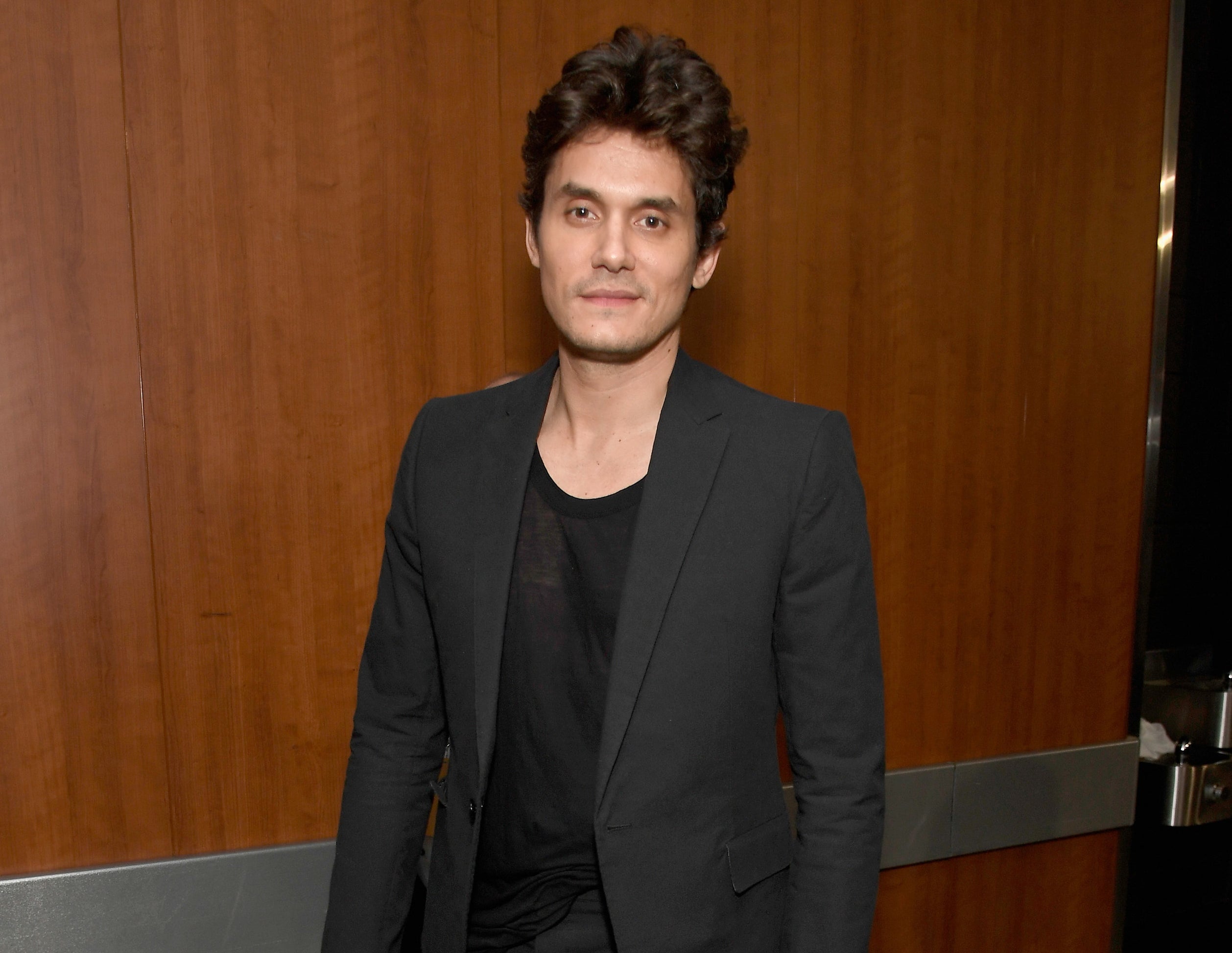 John wears a suit jacket to an event