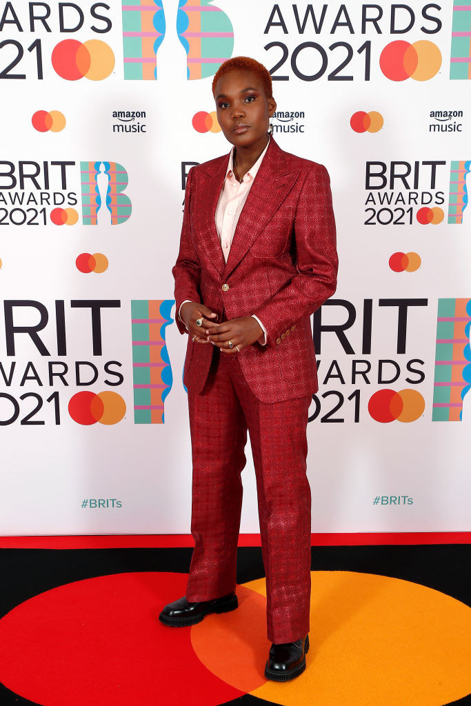 Arlo Parks rocks a pantsuit that matches her hair color at The BRIT Awards 2021