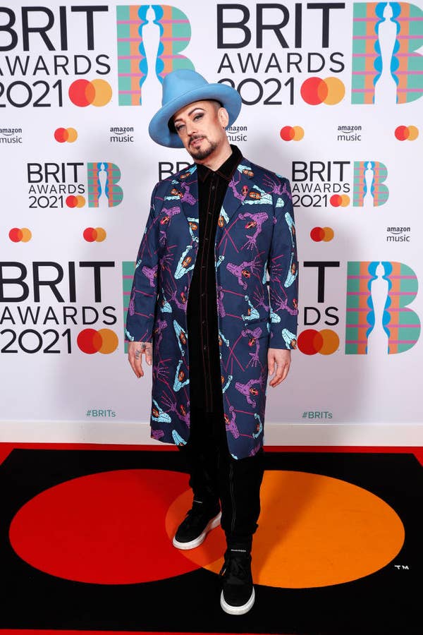 Boy George poses in the media room