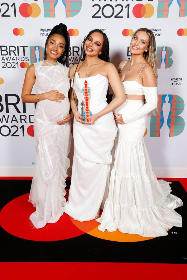 Leigh-Anne Pinnock, Jade Thirlwall, and Perrie Edwards of Little Mix pose with their British Group award in the media room