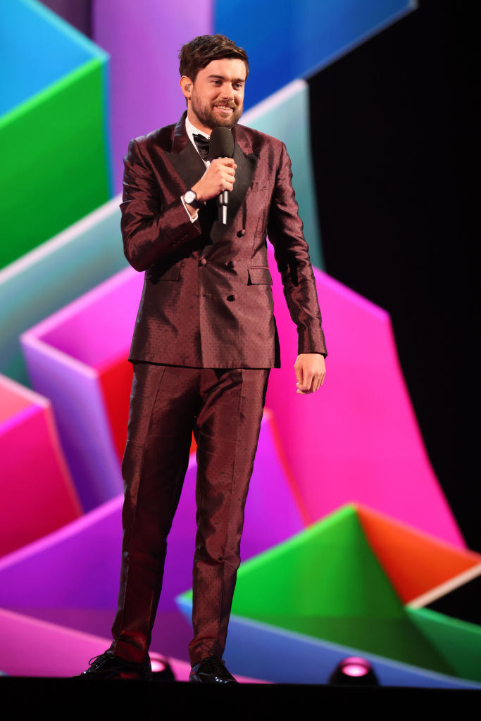 Jack Whitehall speaks on stage during The BRIT Awards 2021