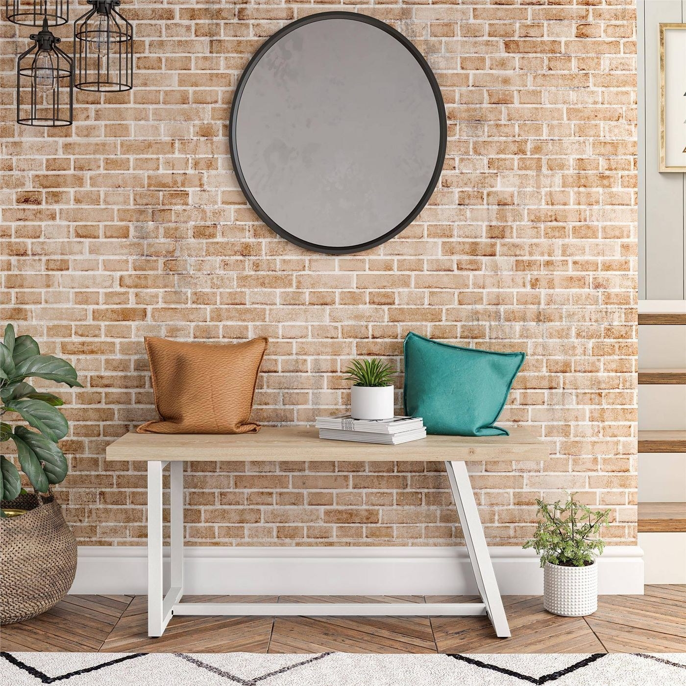 asymmetrical wood bench with white metal legs against a brick wall