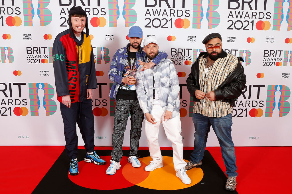 (L-R) Steve Stamp, Allan Mustafa, Hugo Chegwin, and Asim Chaudhry aka Chabuddy G of Kurupt FM attend The BRIT Awards 2021