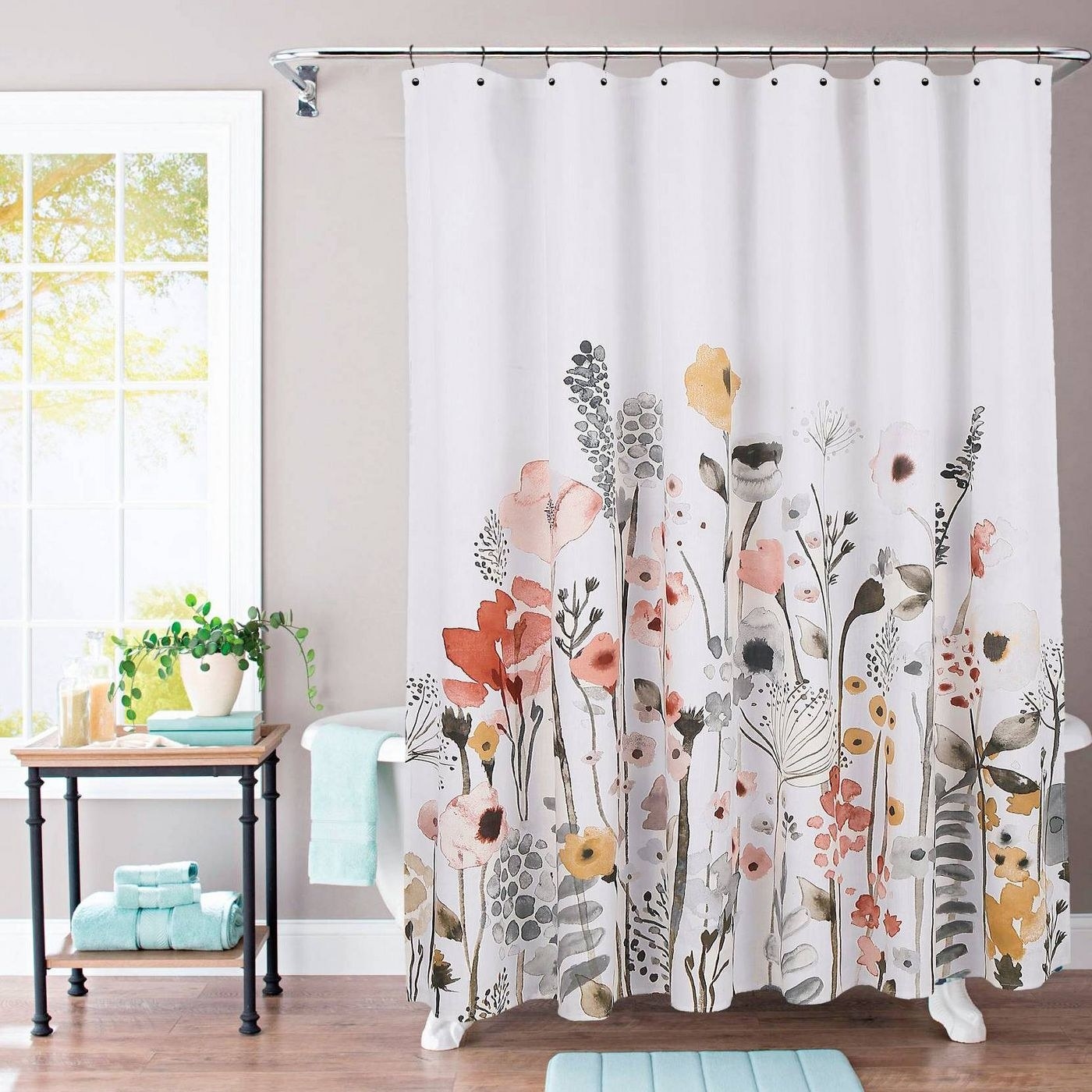 multi-color floral print shower curtain over a tub