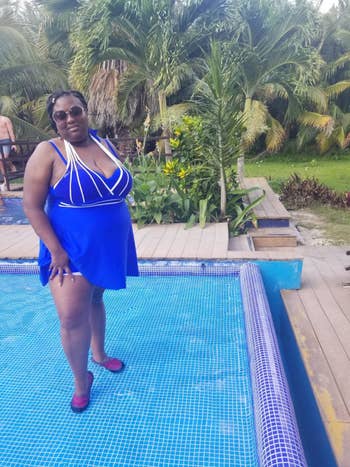 Reviewer wearing the purple swimdress with white strappy detail