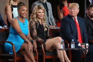 Vivica sits on stage with Donald Trump and the other contestants