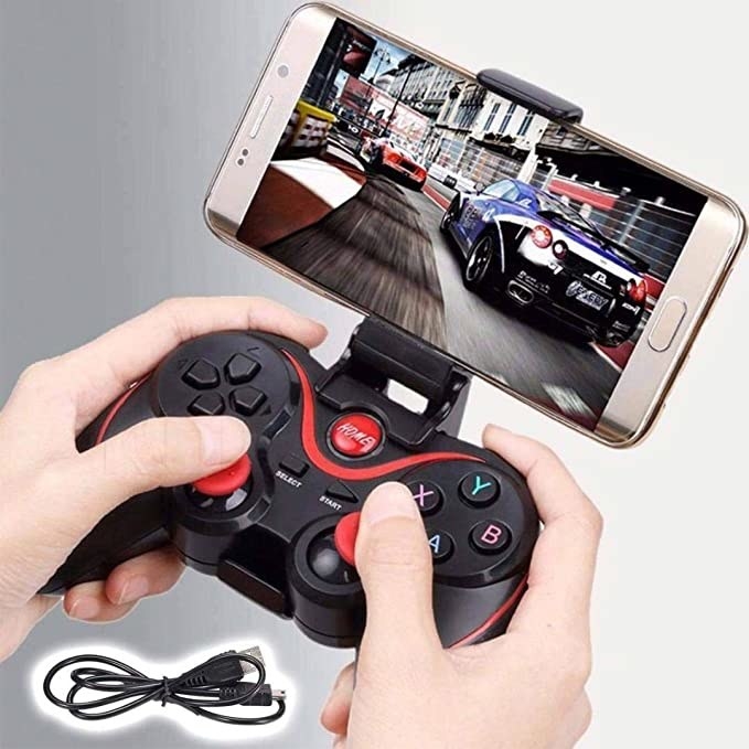 A person using the controller to play a game on their mobile phone.
