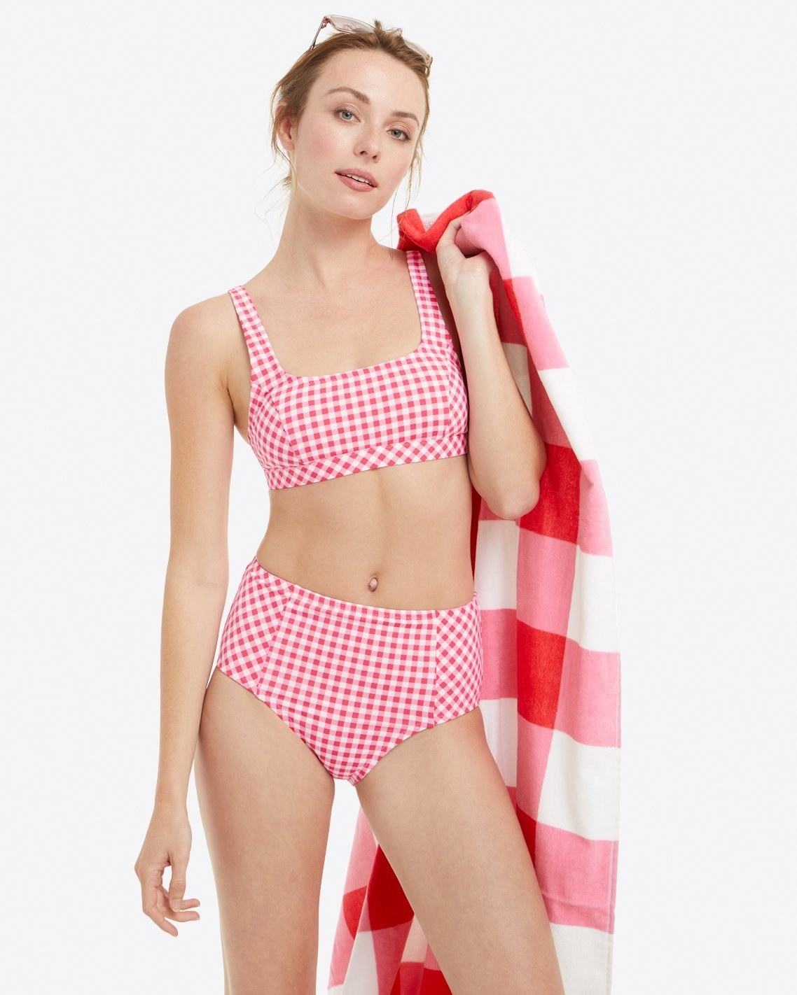 model wearing the red and white gingham bikini 
